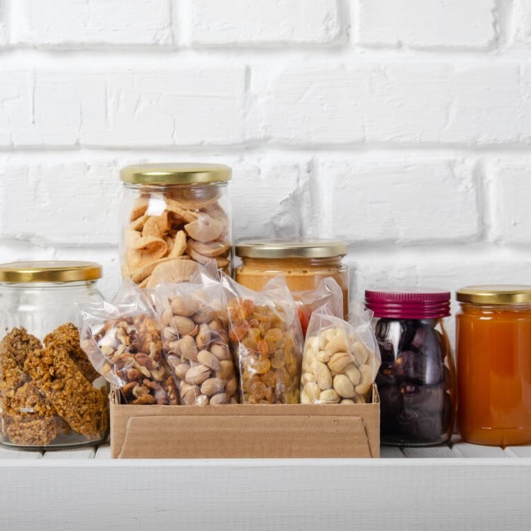 Set of long storage term mostly dry sweet energy foods on pantry shelf on brick wall background