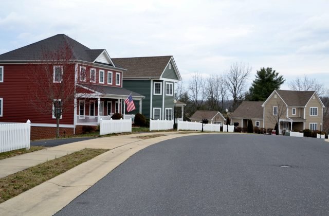 A street of modern homes houses in various colors to make a cozy neighborhood of prime real estate